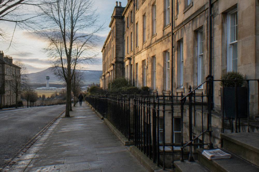 Rows of Georgian townhouses on a wide Edinburgh New Town street