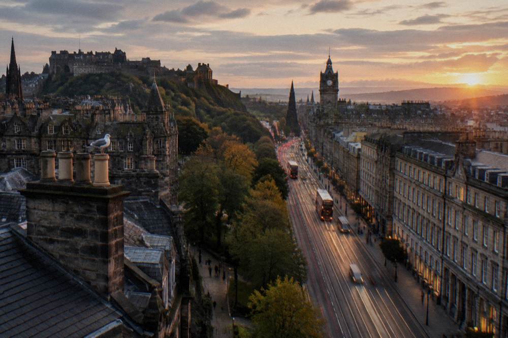 View across Princes Street Gardens showing Old Town buildings on one side and New Town terraces on the other
