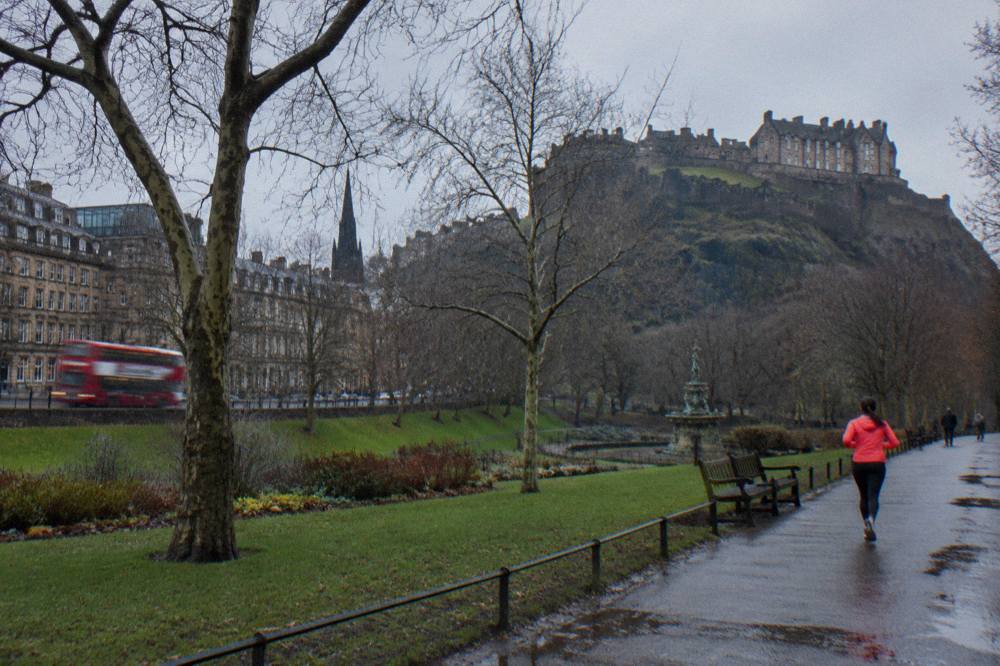 Princes Street gardens and castle rock under low winter cloud