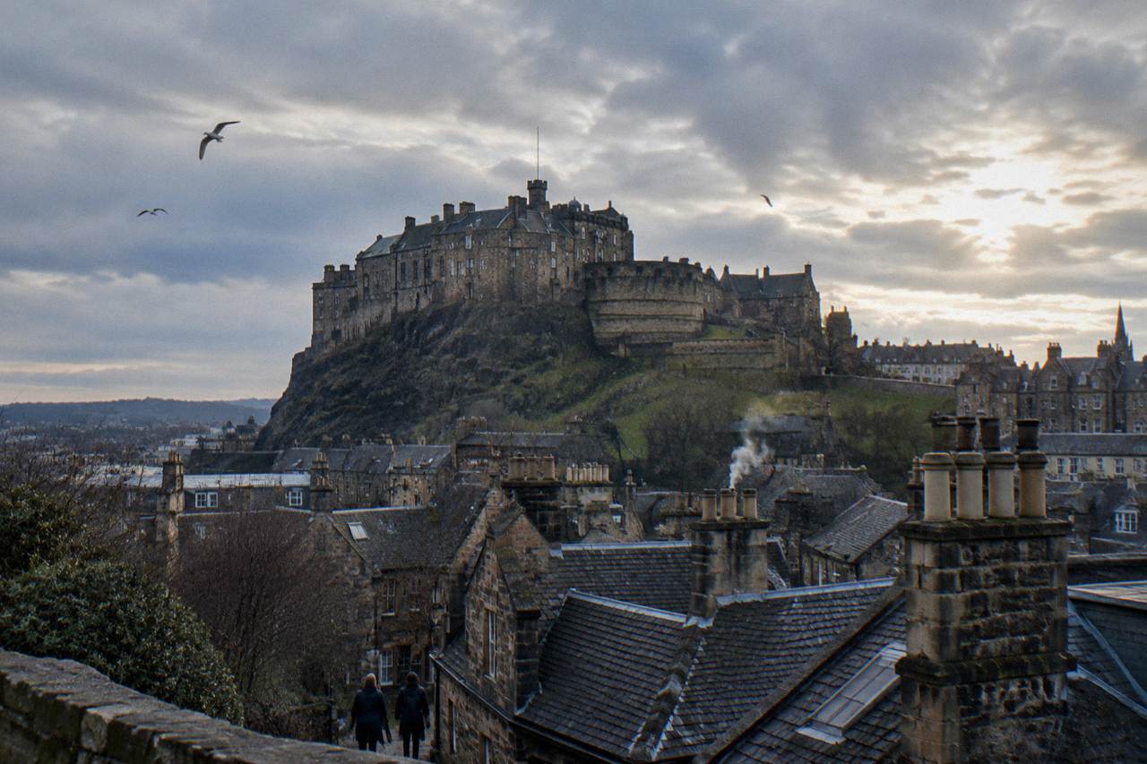 Edinburgh Castle above rooftops in winter light