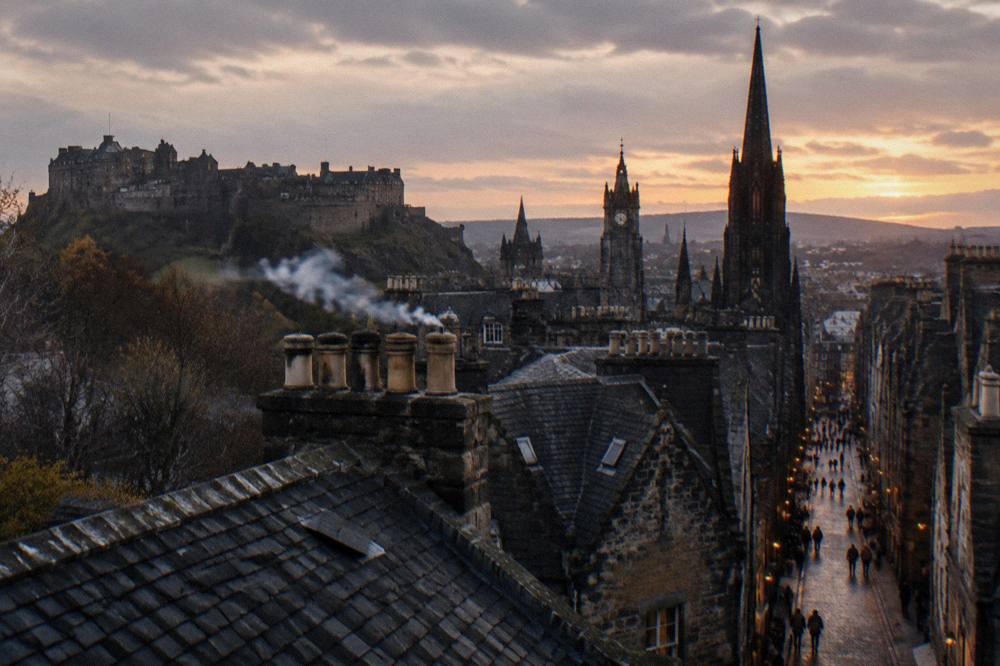 Evening light on the rooftops and spires of central Edinburgh from a high viewpoint