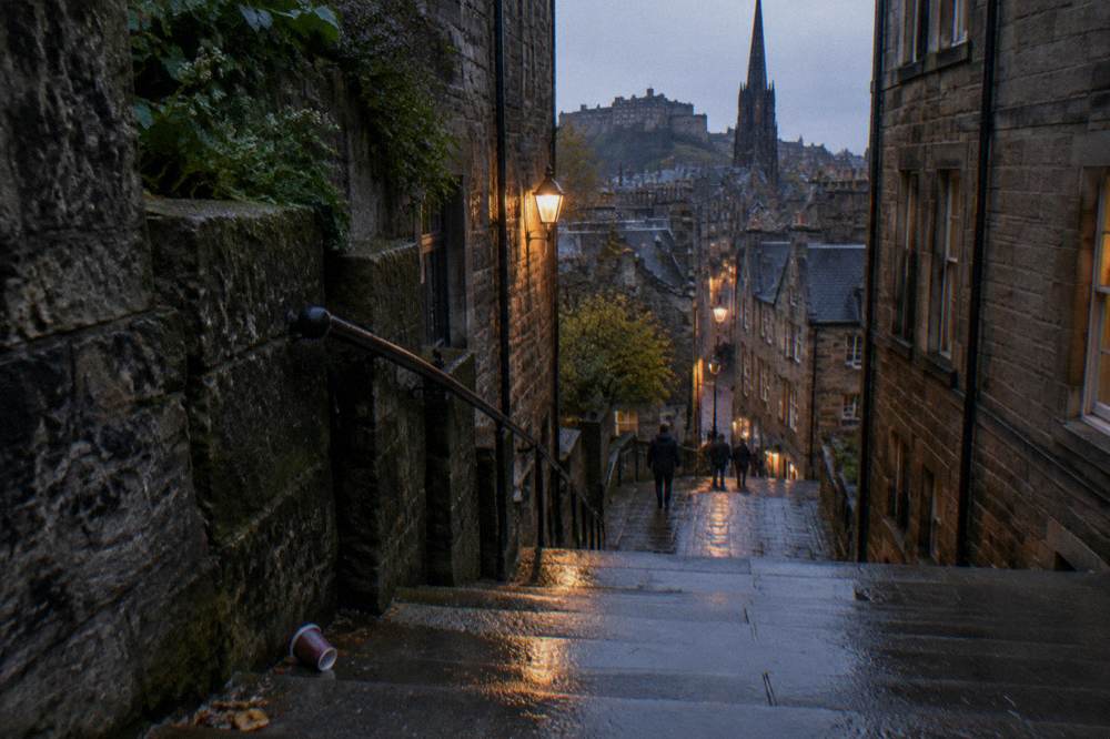 Weathered stone staircase close sloping between tall tenements in the Old Town