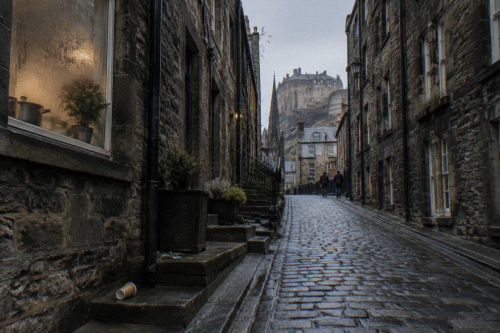 Cobbled close rising from street level towards Old Town buildings in Edinburgh